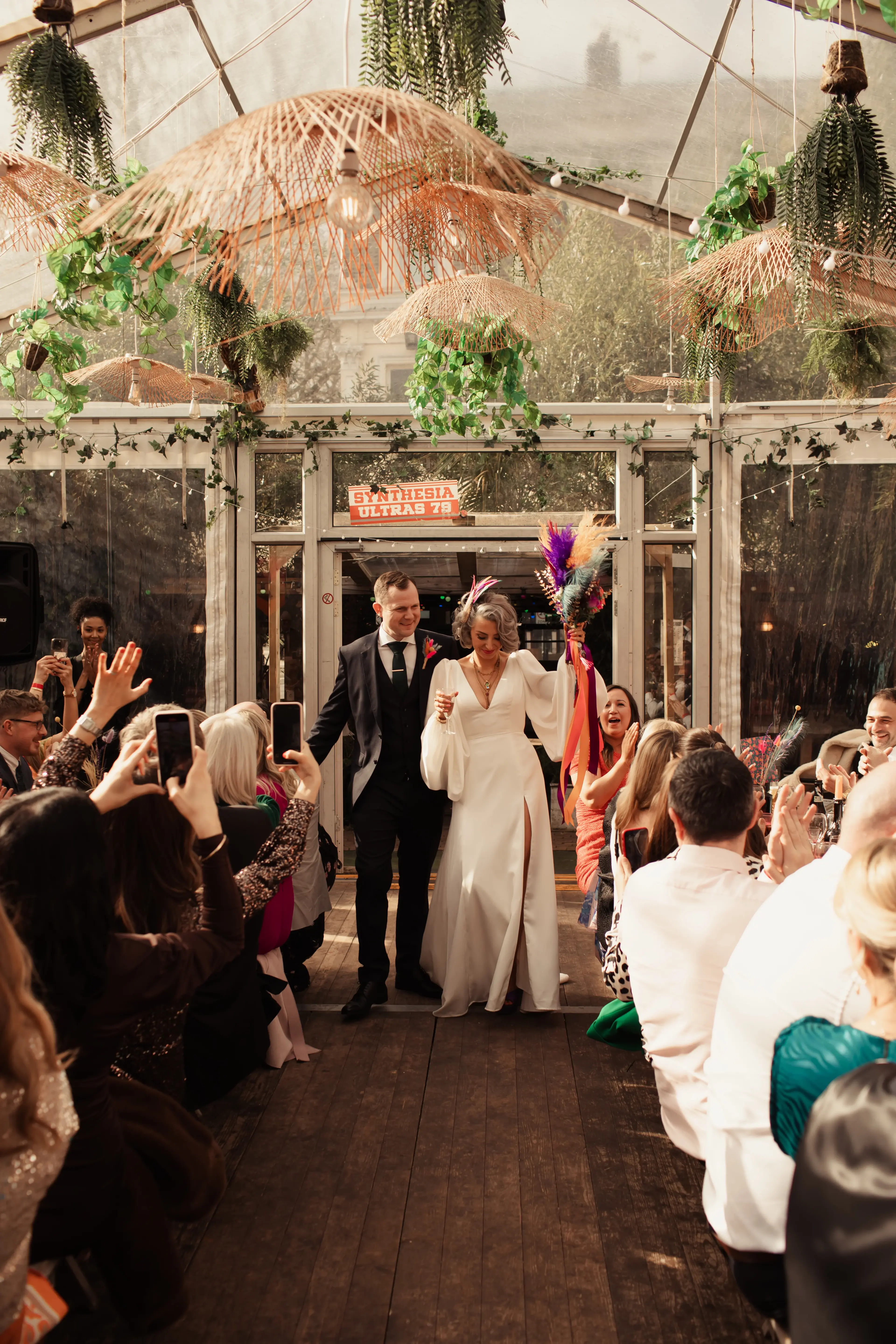 Bride and groom entering their London Pub Wedding party