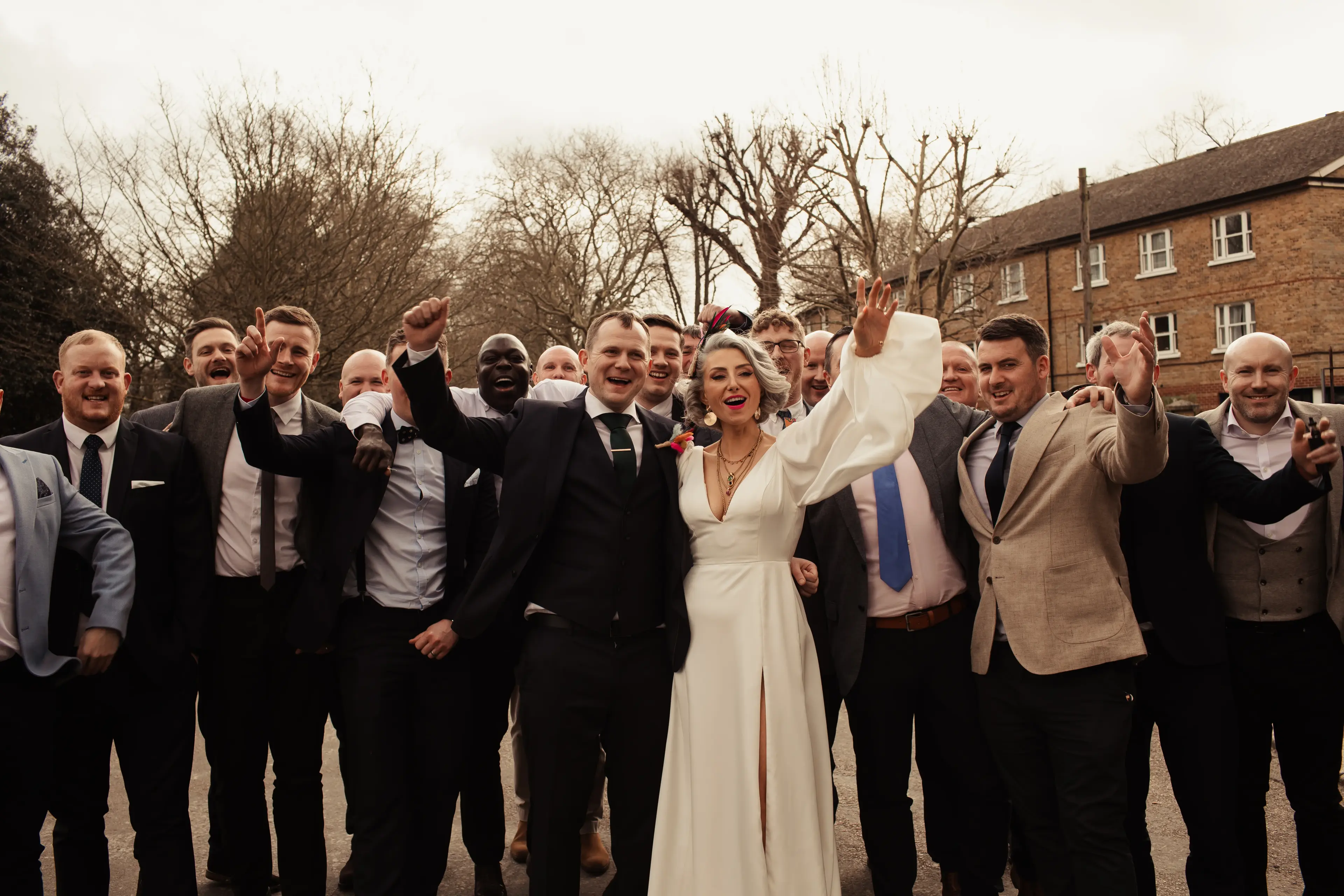 Bride and groom celebrating their wedding with guests in a London park