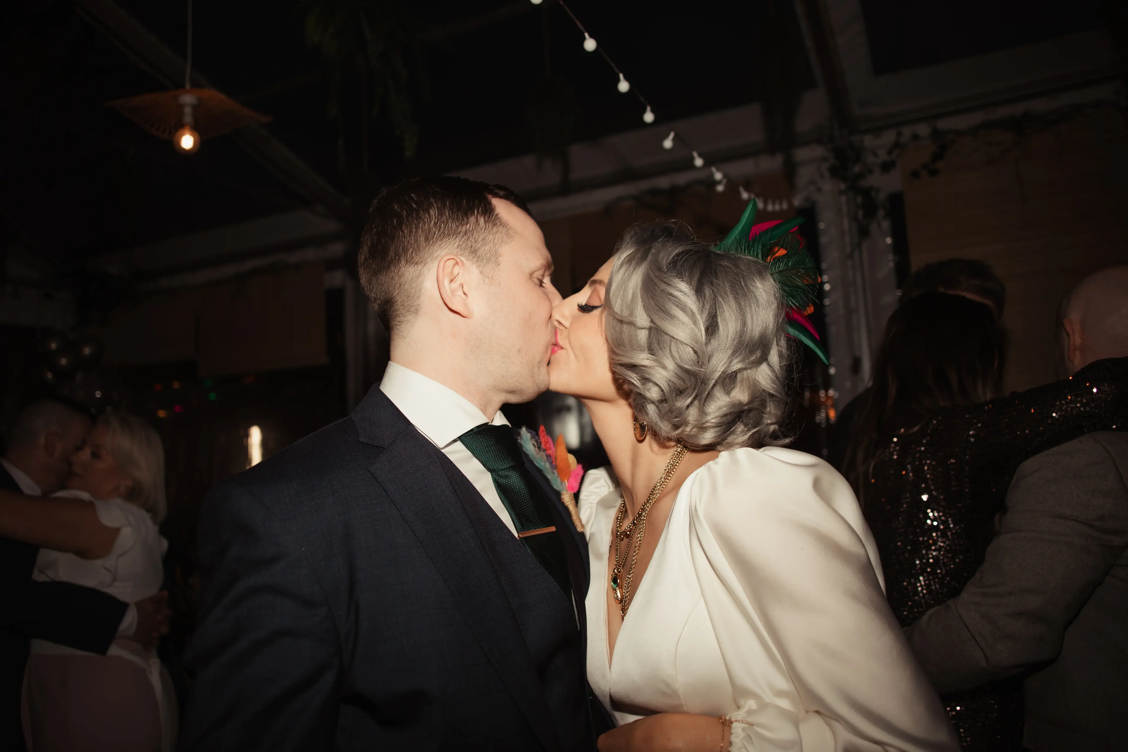Bride and groom sharing a kiss during their London pub wedding reception