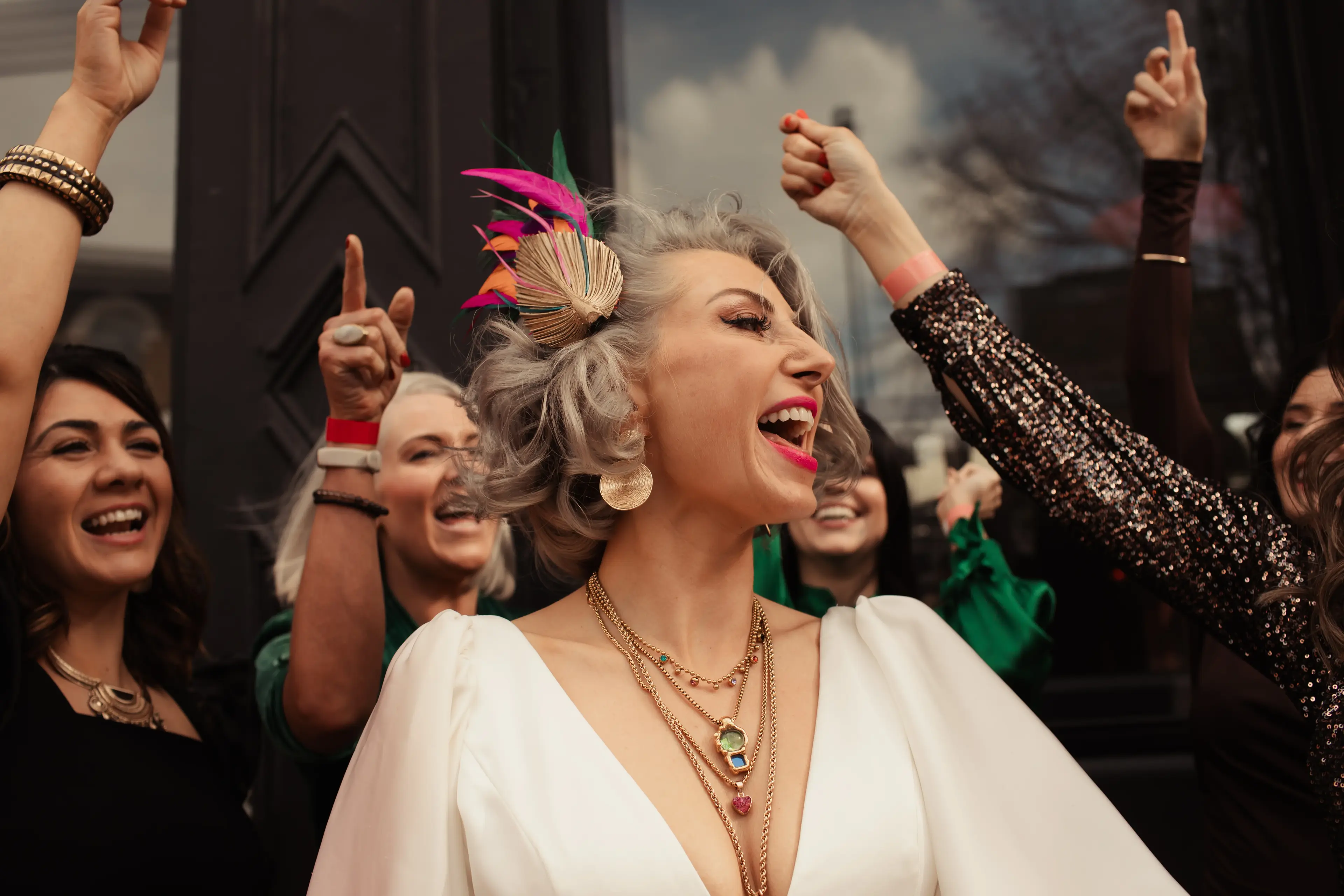 Bride celebrating with friends outside the People's Park Tavern, Hackney, London