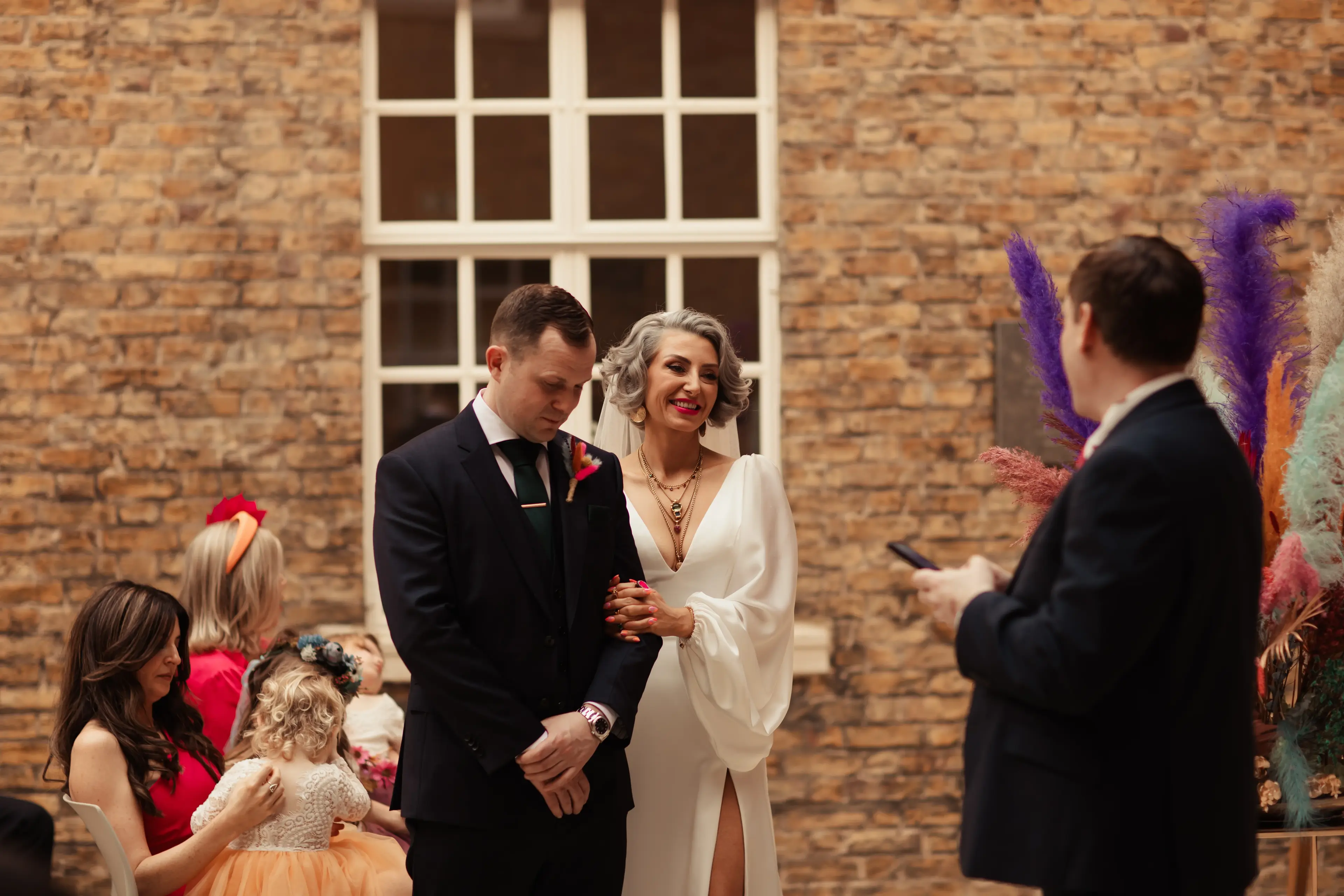 Bride and groom stood together during their wedding at Hackney Town Hall