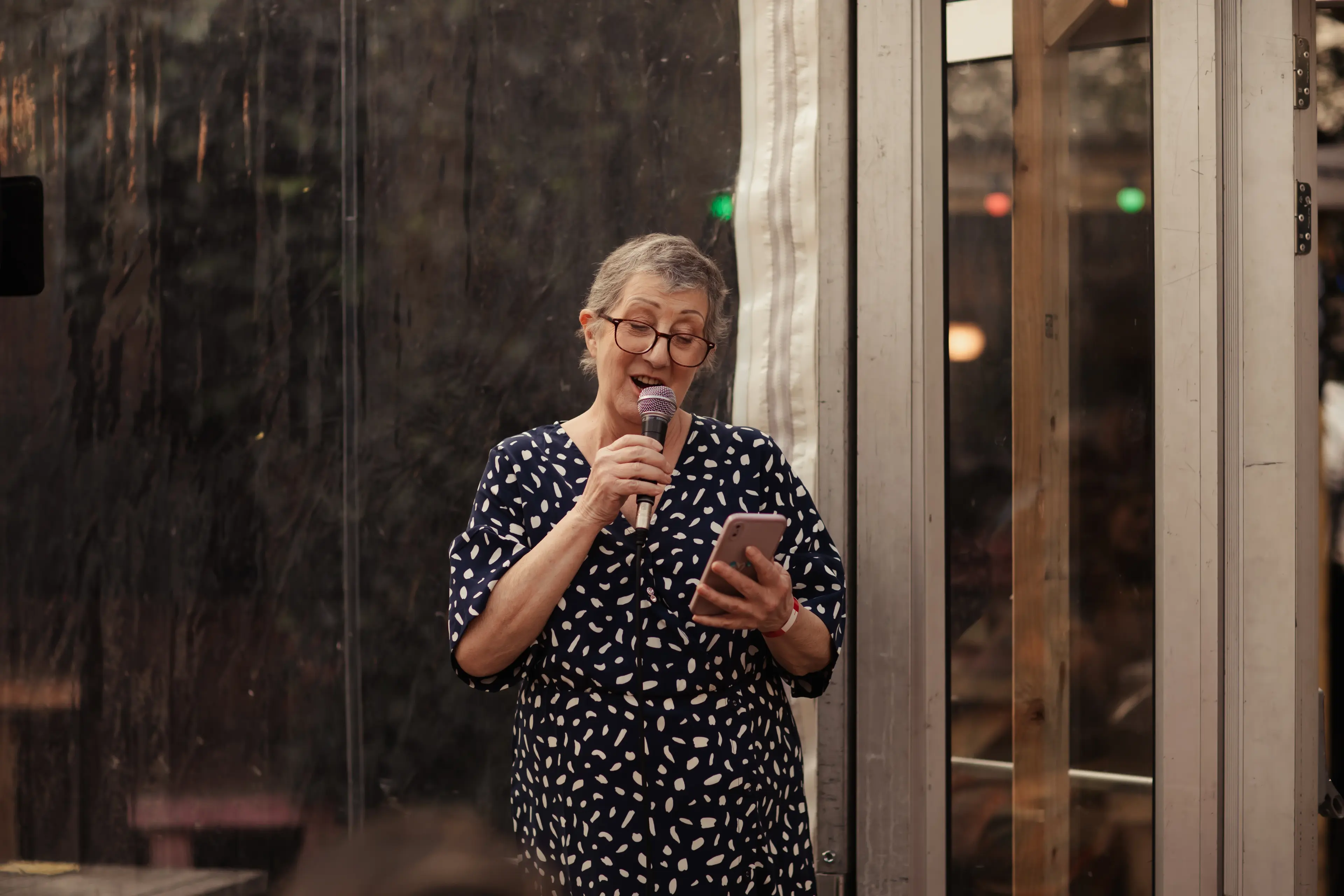 A wedding guest doing their speech during a pub drinks reception in London