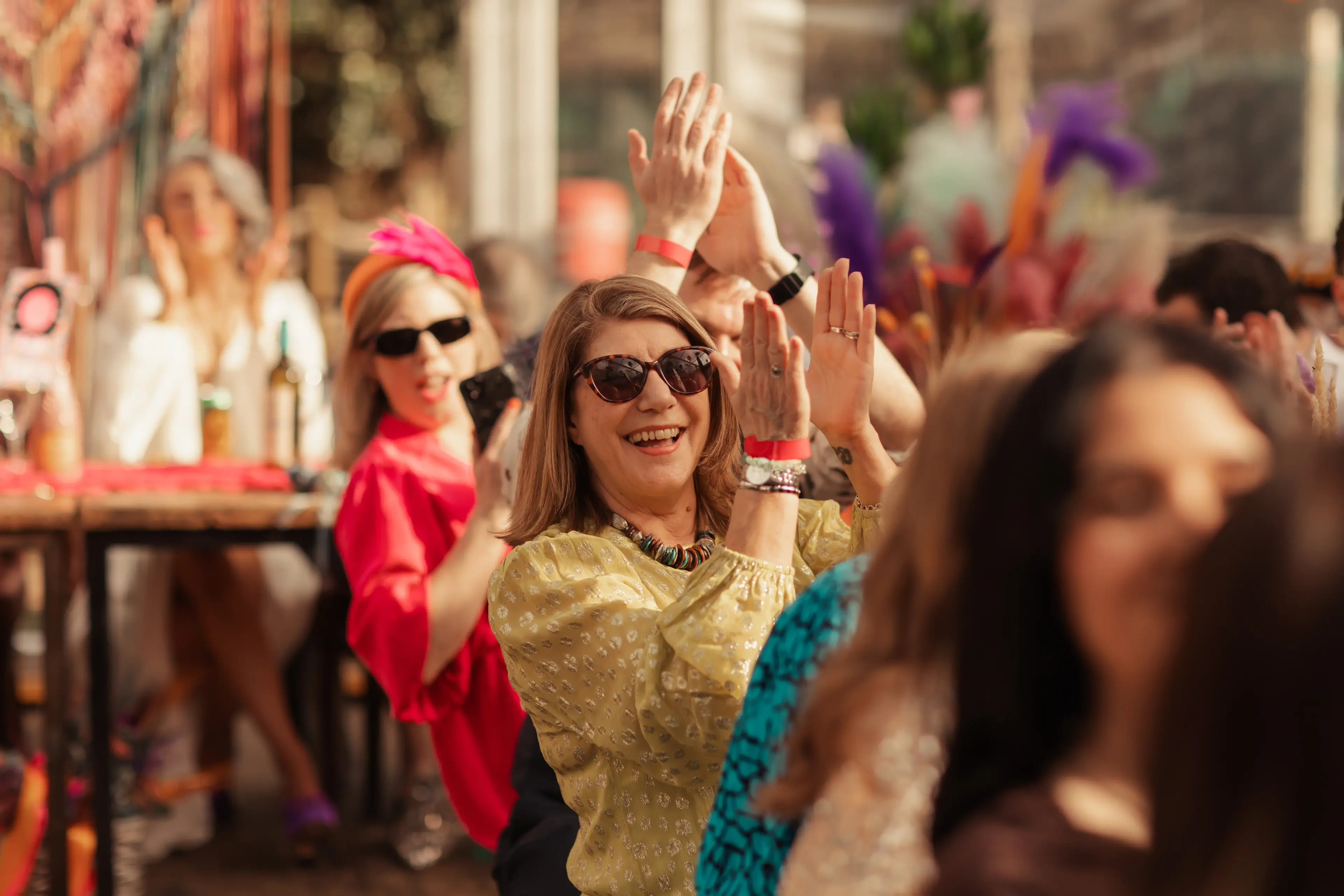 Wedding guests applauding speeches in the People's Park Tavern, London