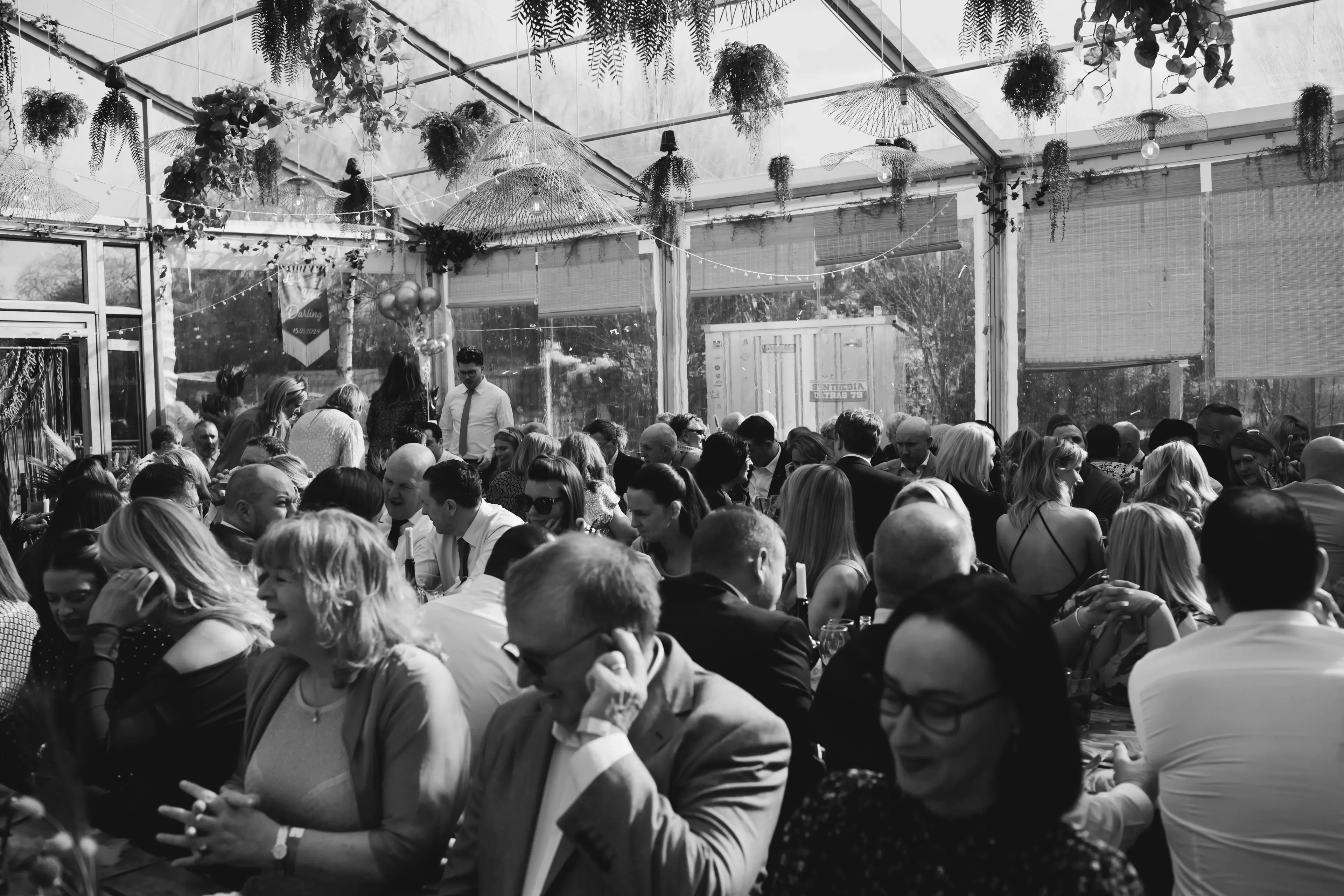 Guests laughing and chatting during a London pub wedding reception